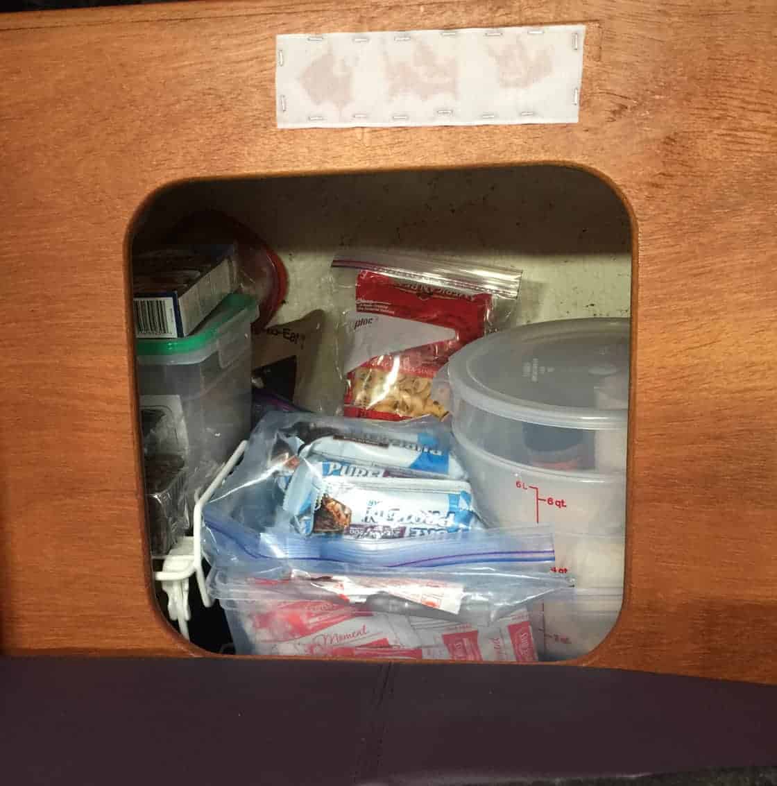 Storage behind starboard settee